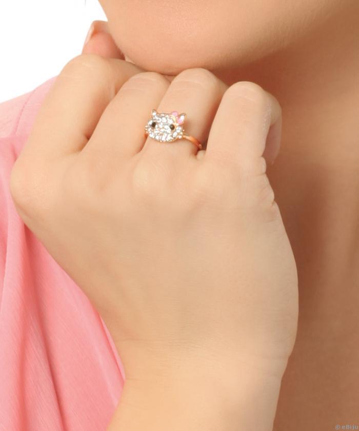 Hello Kitty gyűrű, aranyszínű fém fehér strasszokkal és rózsaszín masnival