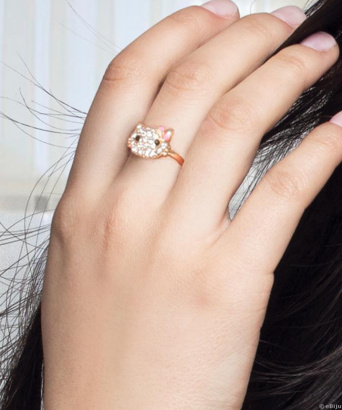 Hello Kitty gyűrű, aranyszínű fém fehér strasszokkal és rózsaszín masnival